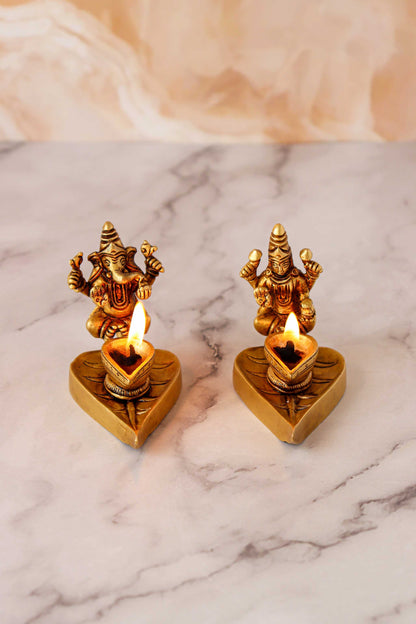 Brass Ganesh & Laxmi Sitting On Leaf Diya