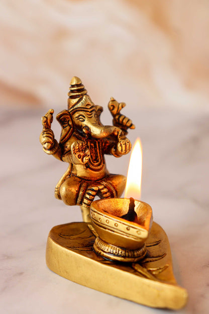 Brass Ganesh & Laxmi Sitting On Leaf Diya